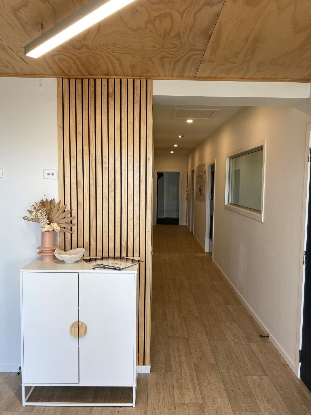 Nurture and Bloom | Entrance at our purpose built childcare centre with batten feature wall