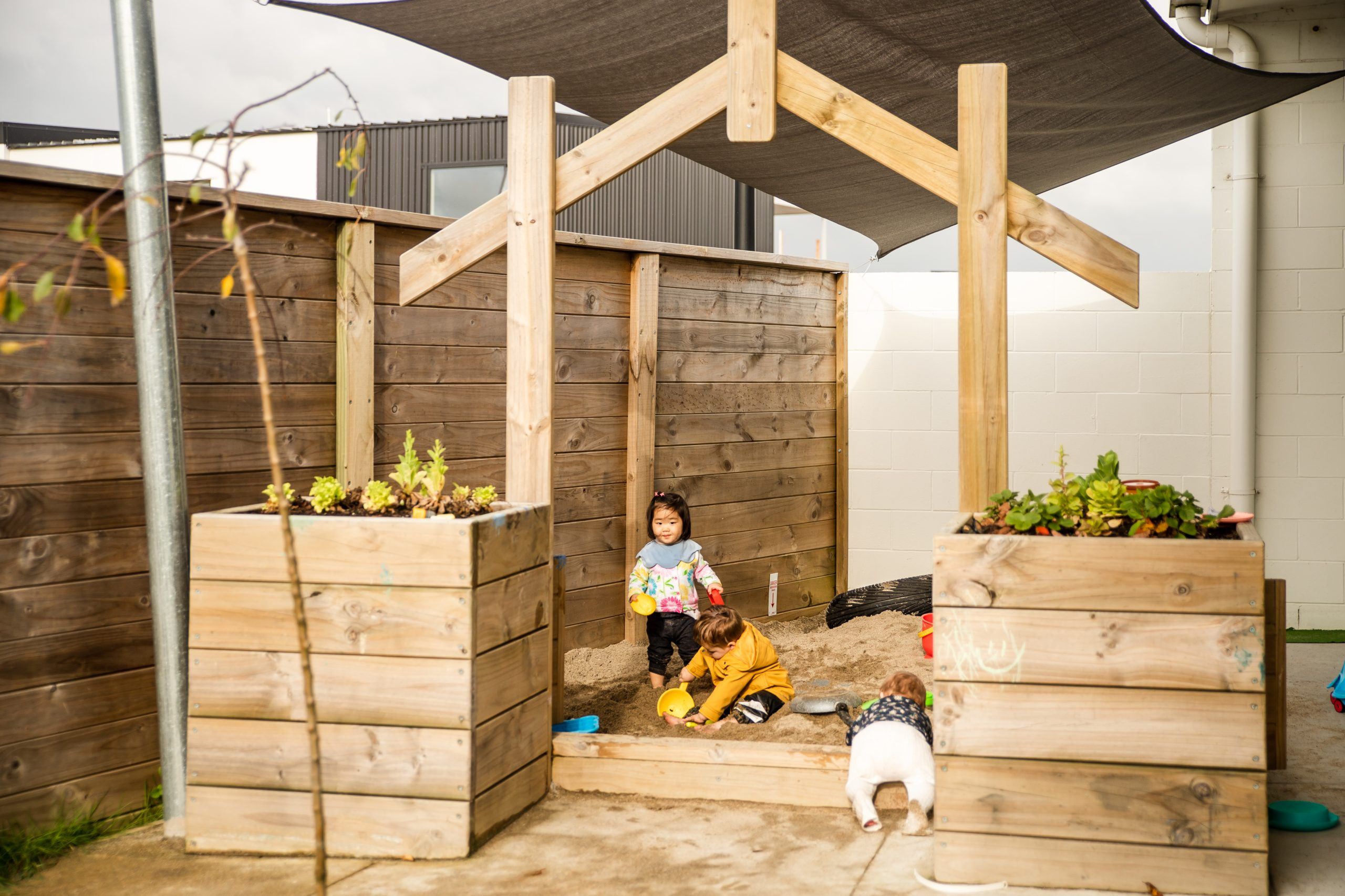 Nurture and Bloom | Outdoor sandpit with vegetable garden
