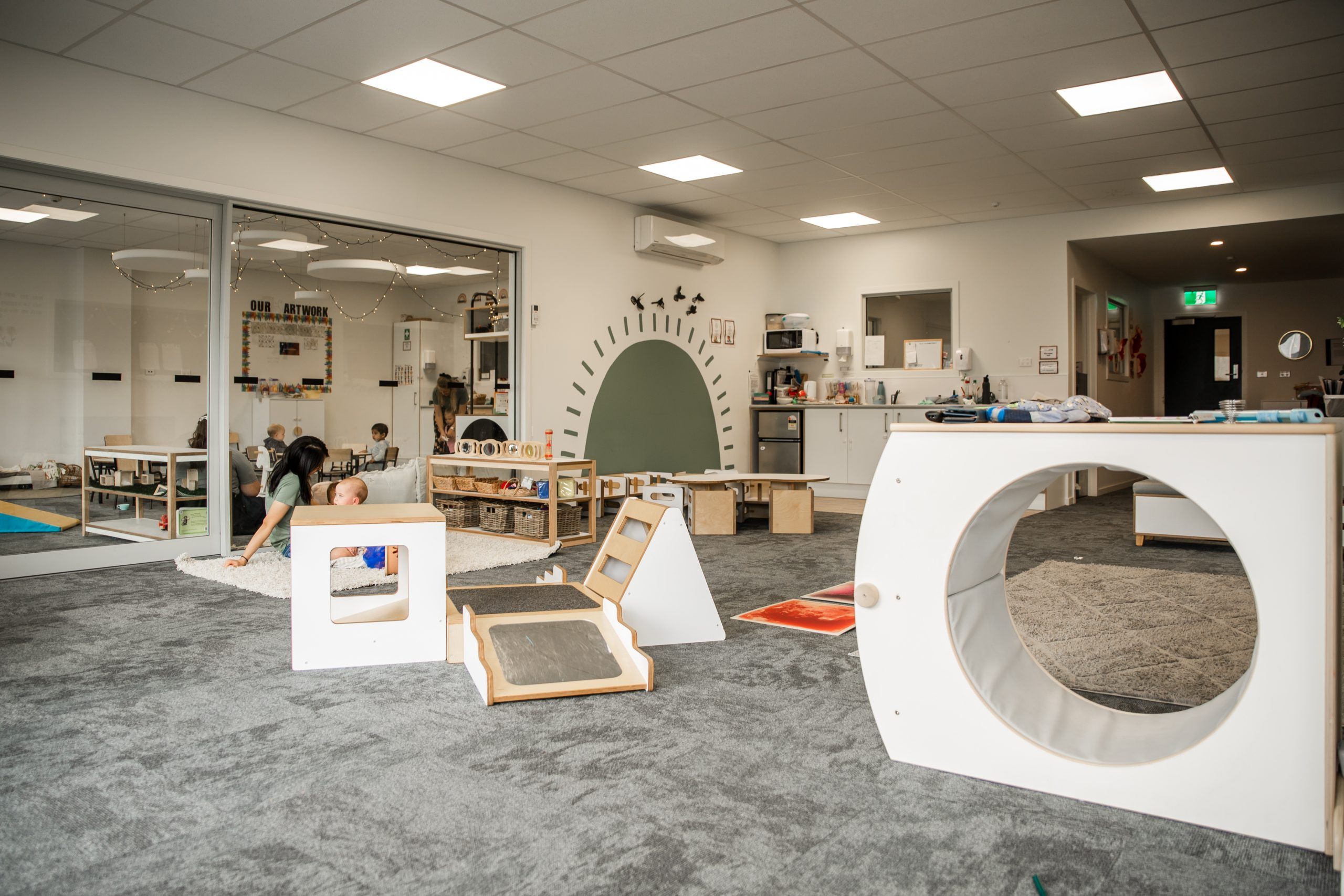 Nurture and Bloom | One of our inside playspaces with a range of play equipment