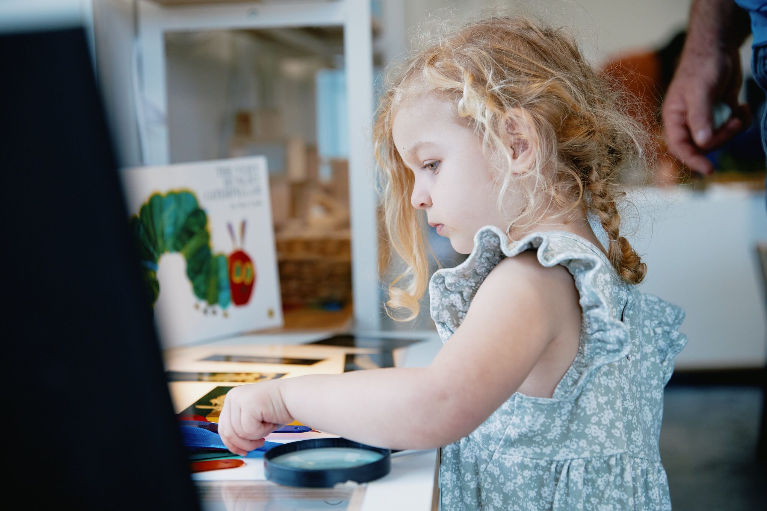 Nurture & Bloom | Child enjoying our learning & reading area