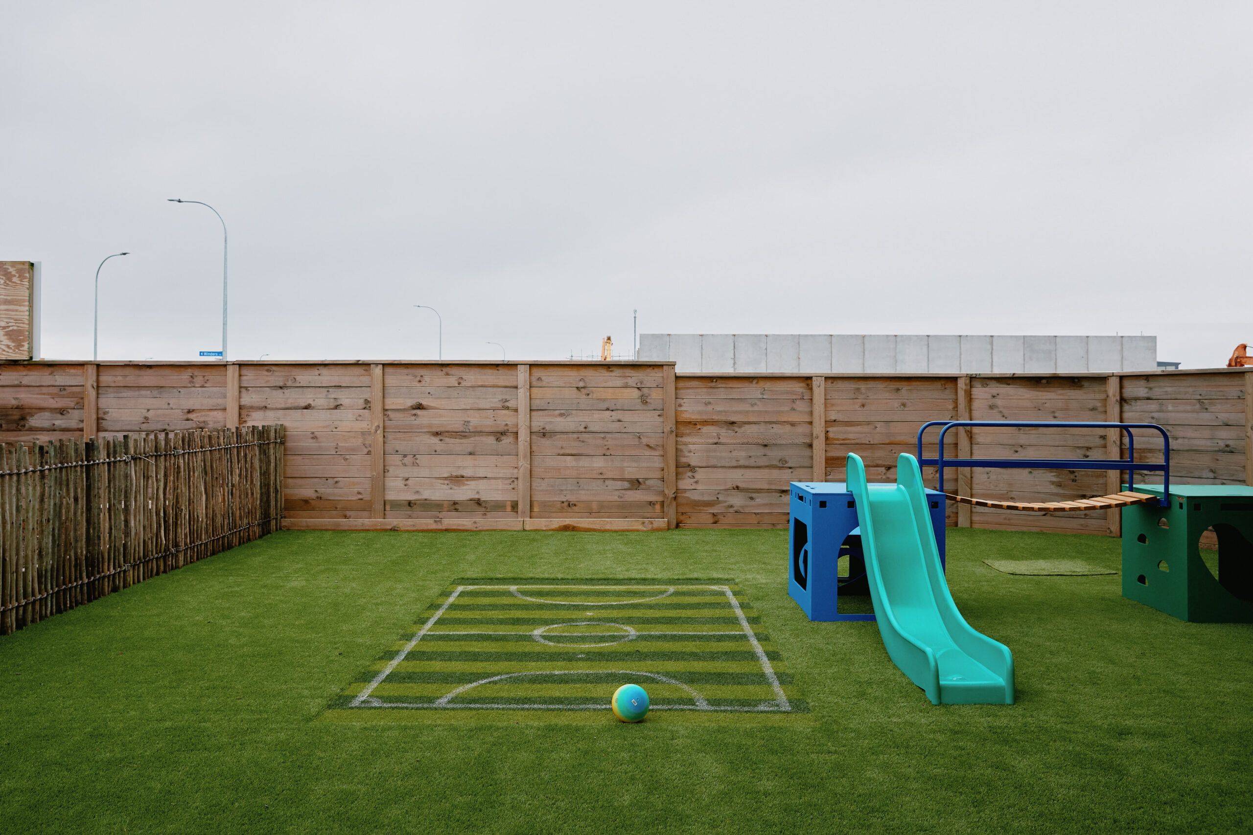 Nurture & Bloom | Some of our outdoor play area; football field, slide, bridge, climbing boxes