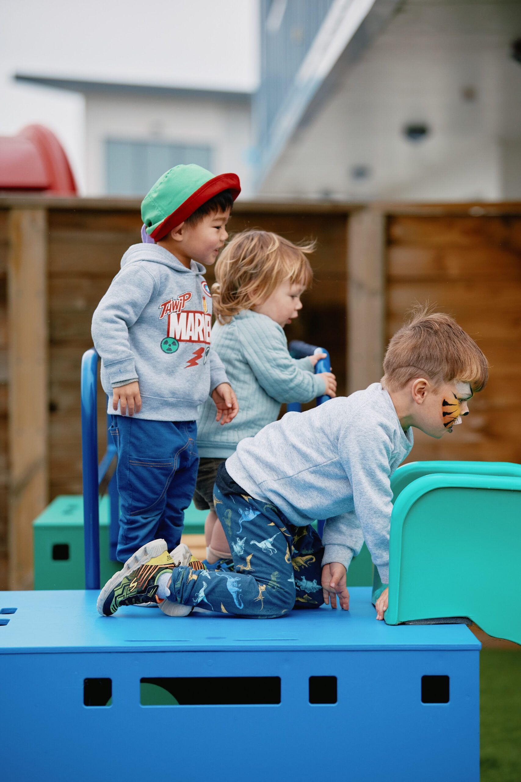 Nurture & Bloom | Children playing on outdoor equipment