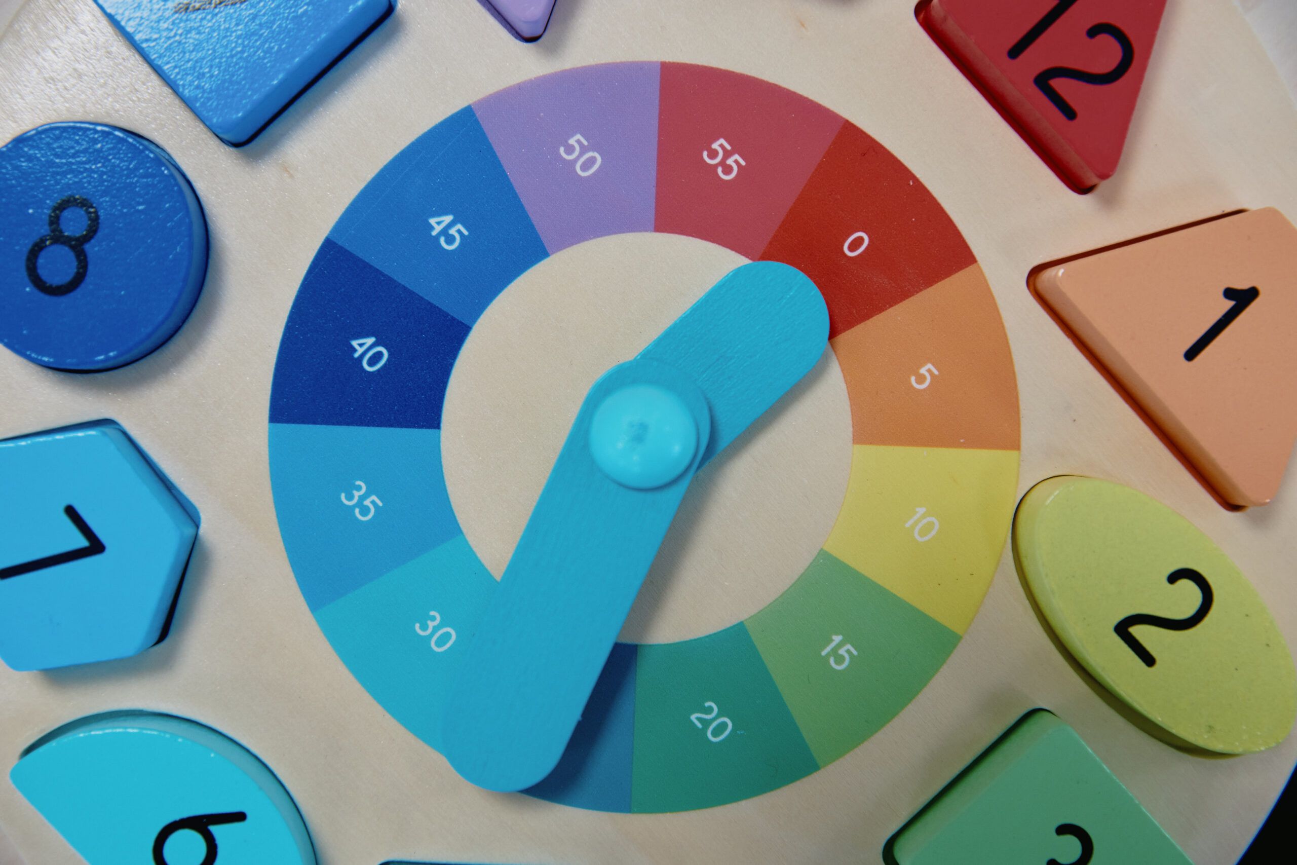Nurture & Bloom | Colourful wooden puzzle clock learning activities