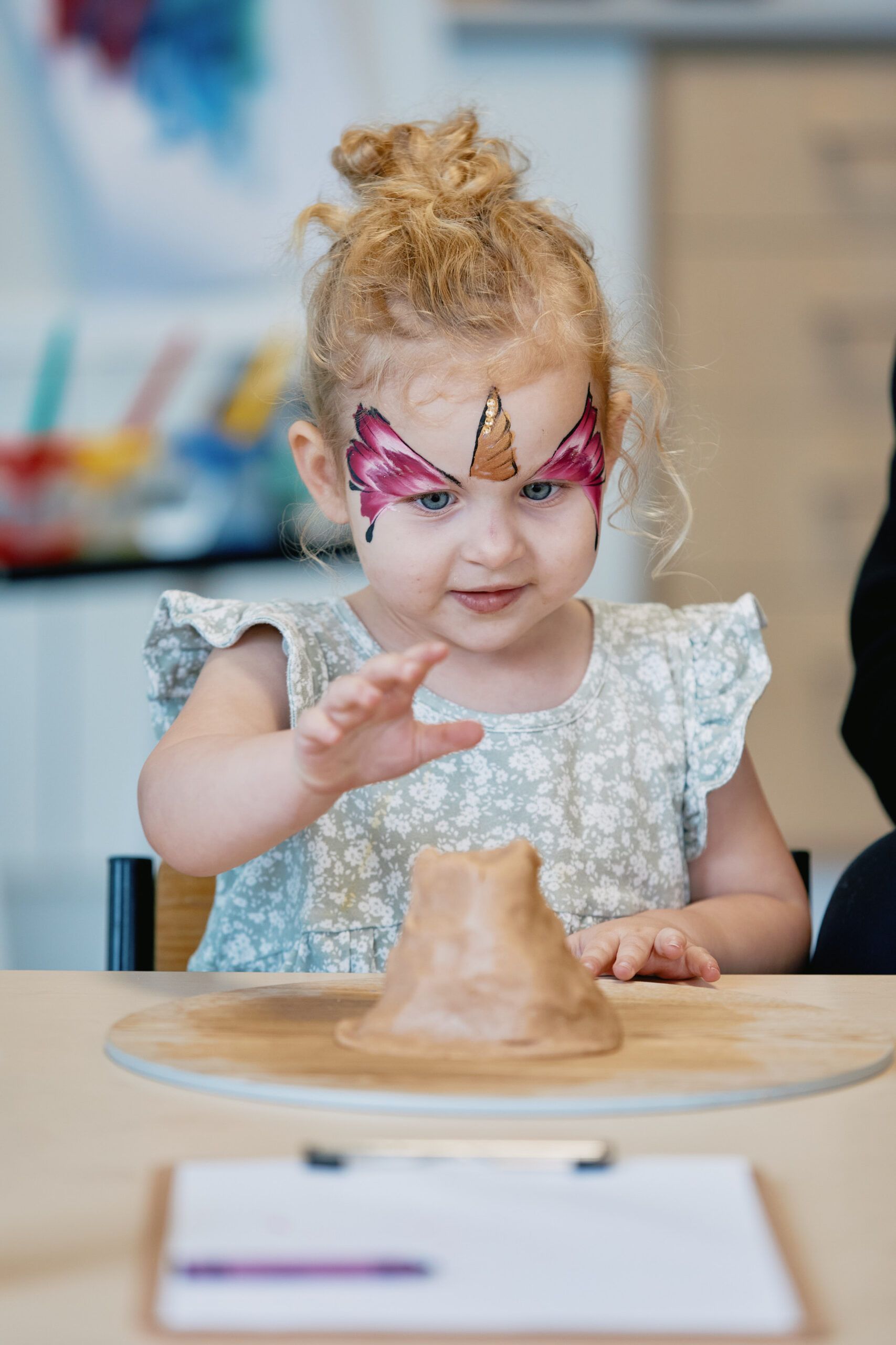 Nurture & Bloom | Child playing and learning with clay